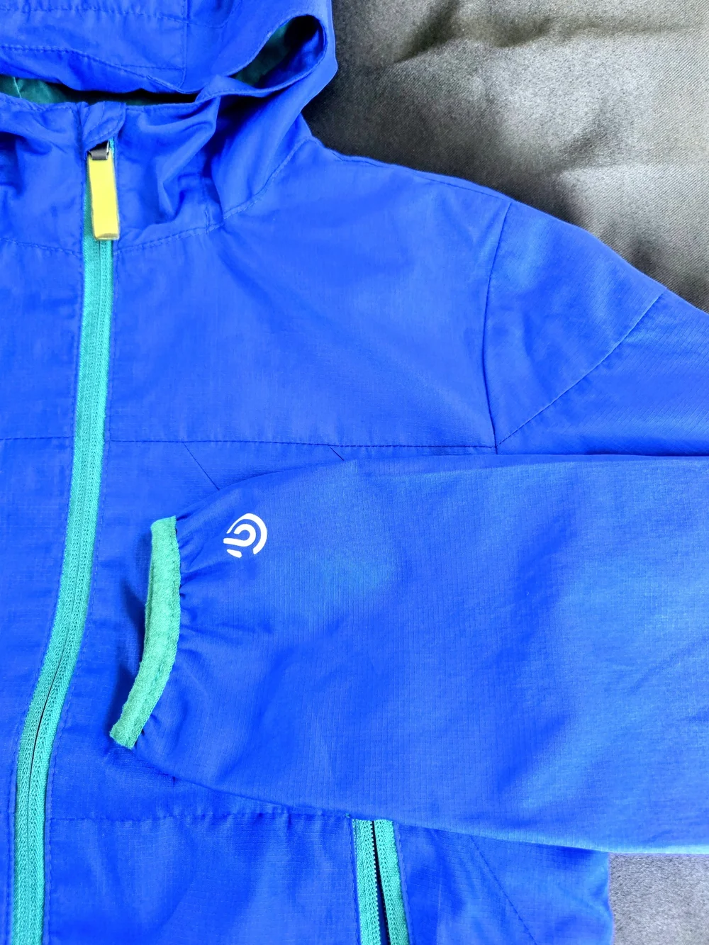 Champion Bright Blue Hooded Raincoat with Green Zippers